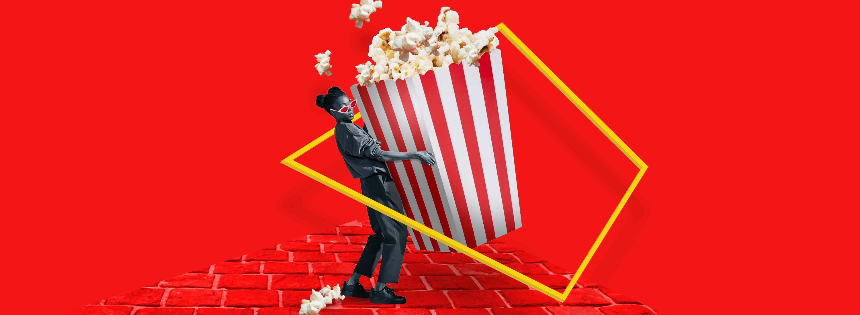 A composite image of a woman holding onto a container of popcorn that is taller than her on a red background