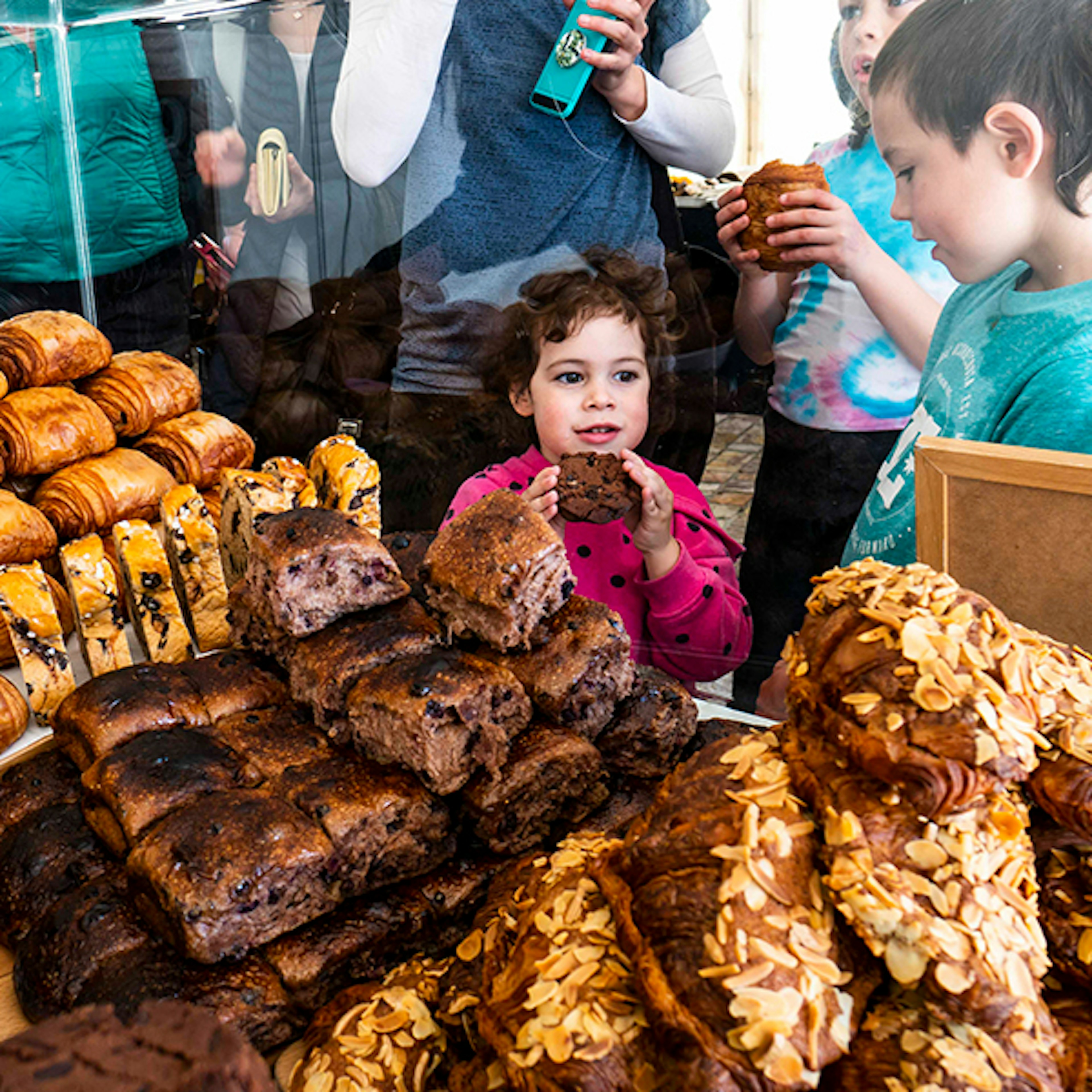 A young child eating pastries at the Little Food Festival