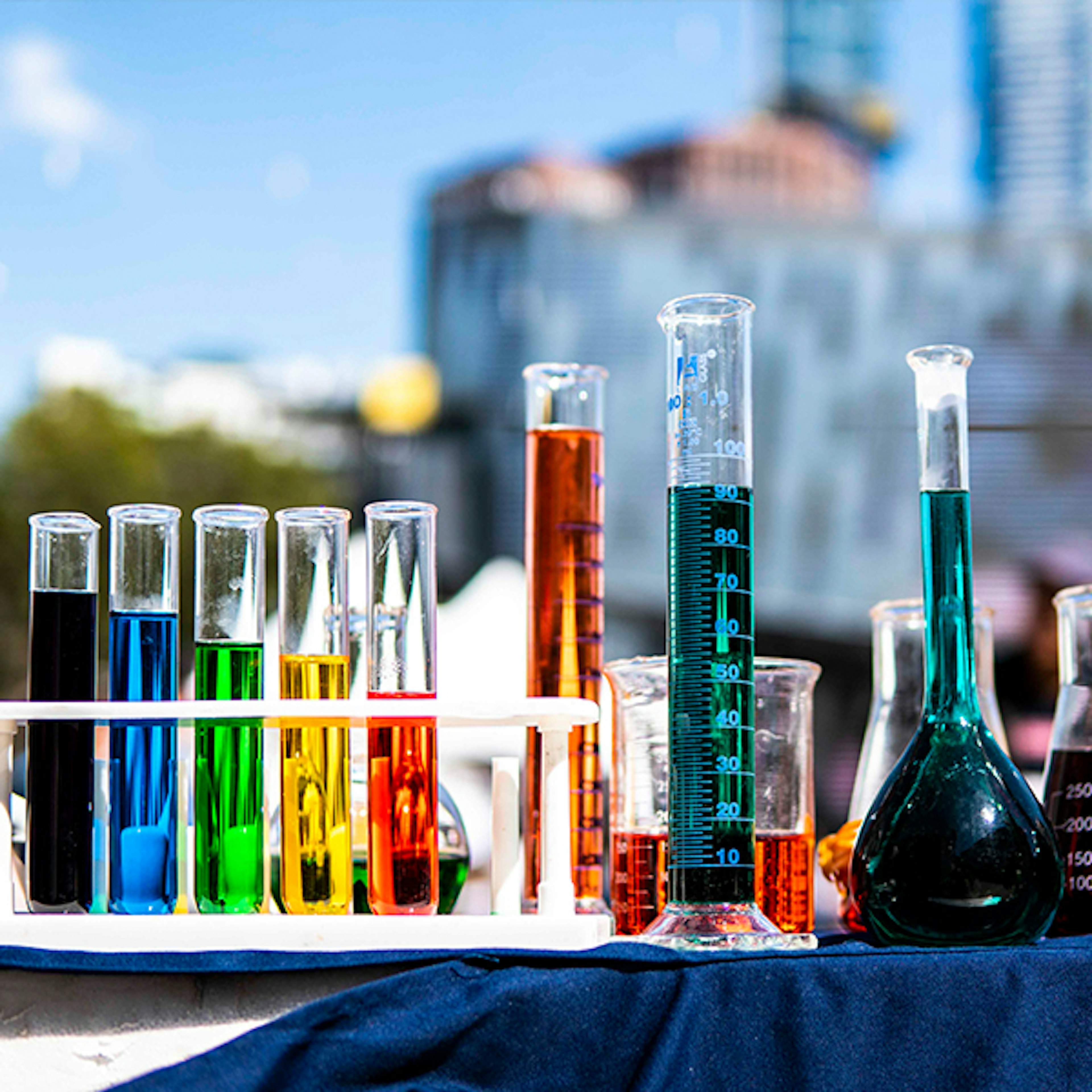 Test tubes and beakers full of colourful liquids at the Little Food Festival