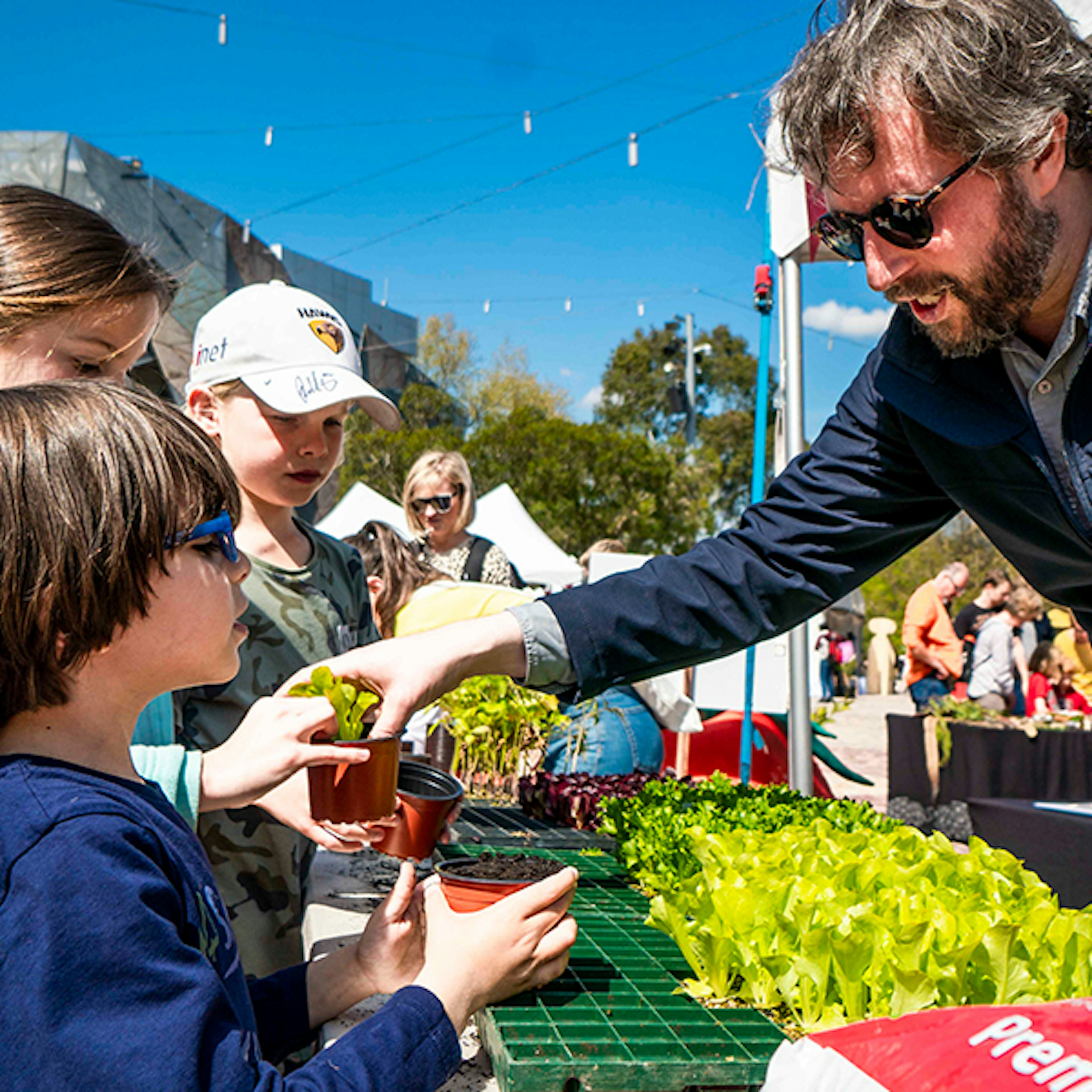 Kids picking up plants at the Little Food Festival