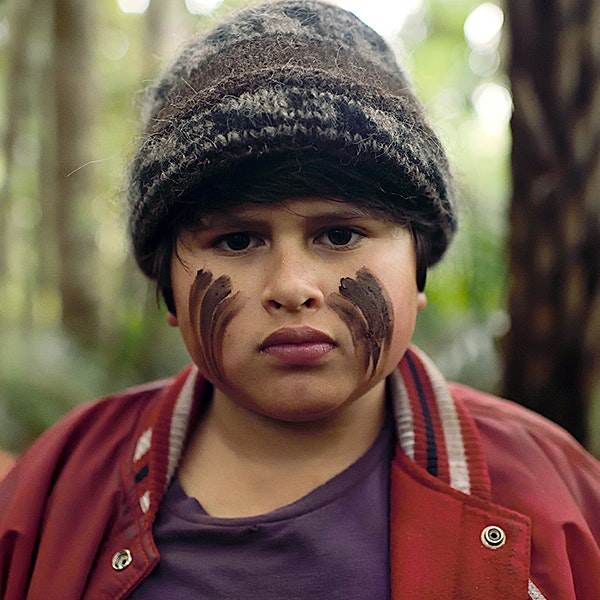 Julian Dennison is dressed as his character Ricky Baker in Hunt for the Wilderpeople
