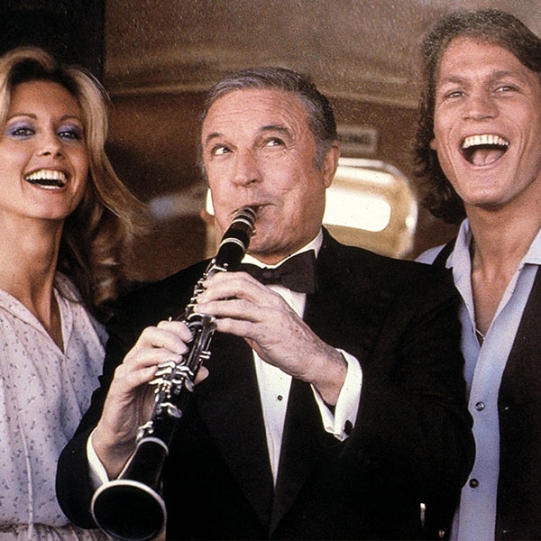 Gene Kelly is playing a clarinet in between Olivia Newton-John and Michael Beck in Xanadu