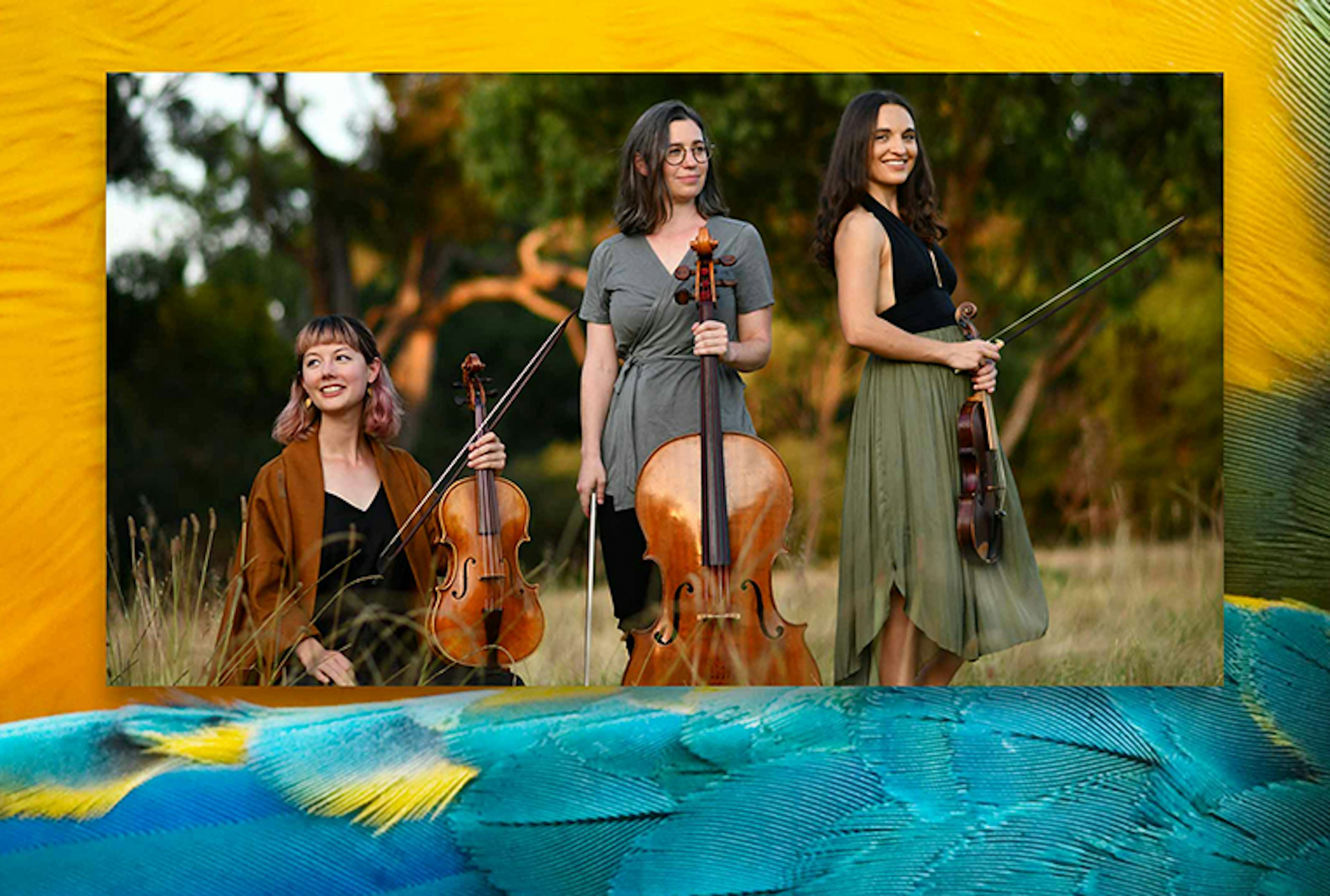 An image of all three members of Wattleseed Ensemble posing for the camera with their instruments