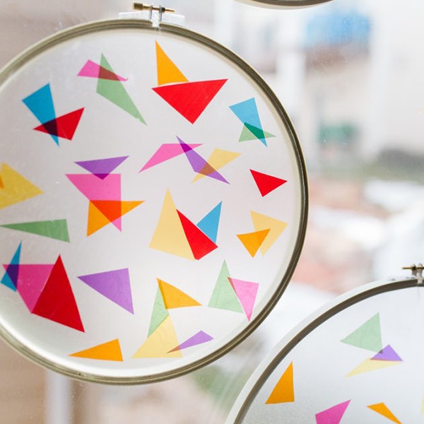 Colourful geometric shapes on circlular hanging objects for the Autumn Spring Carnival Fizz Kidz workshop