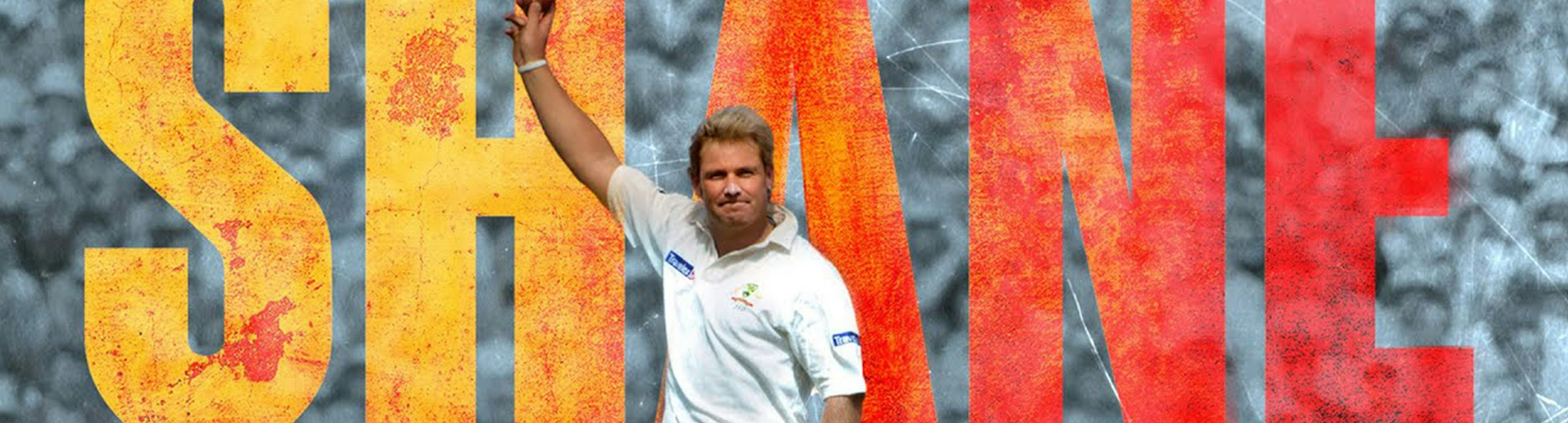 A photo of Shane Warne holding up a cricket ball white the word SHANE photoshopped behind him