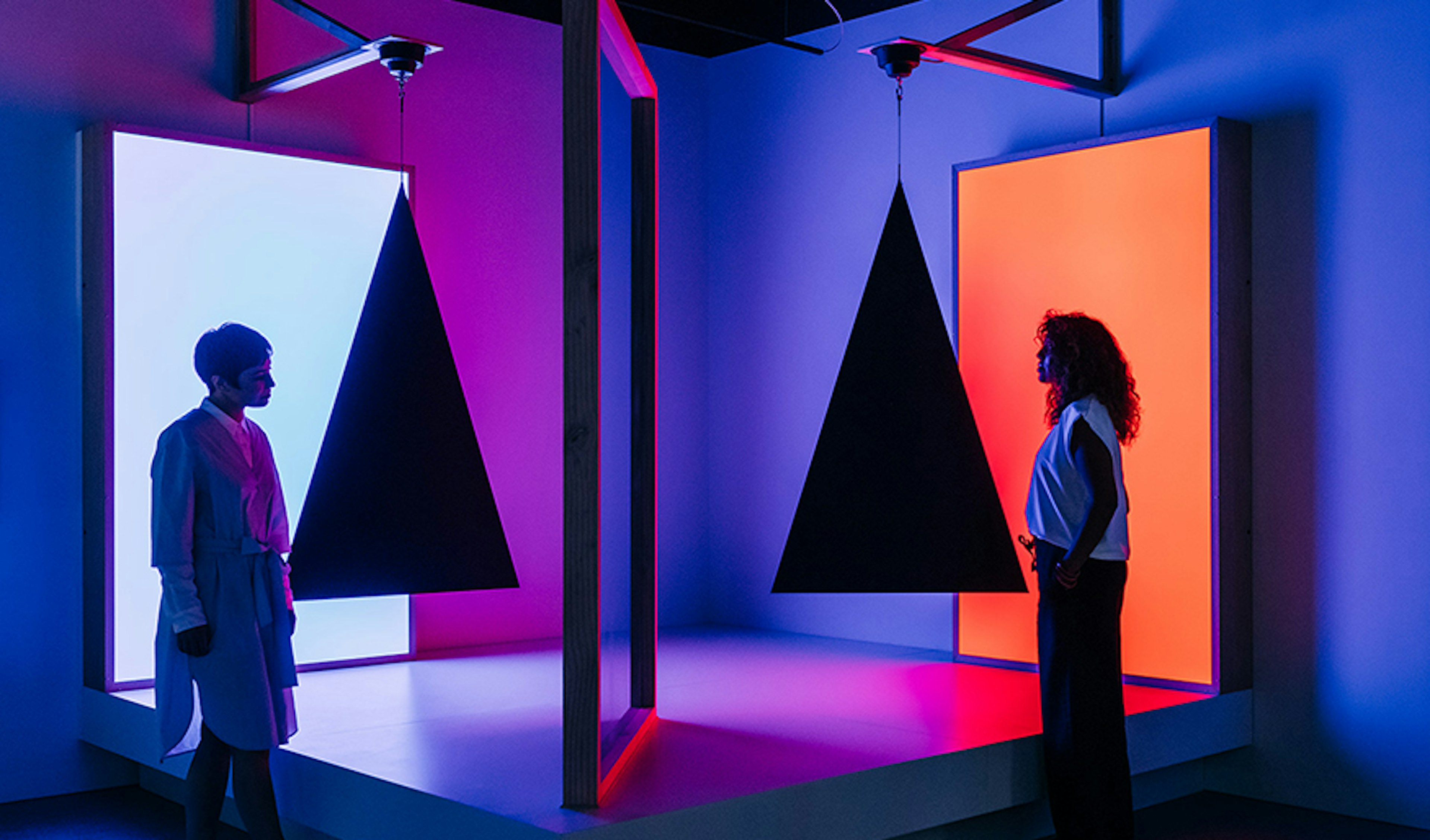 Two women viewing the Story of the Moving Image exhibit at ACMI