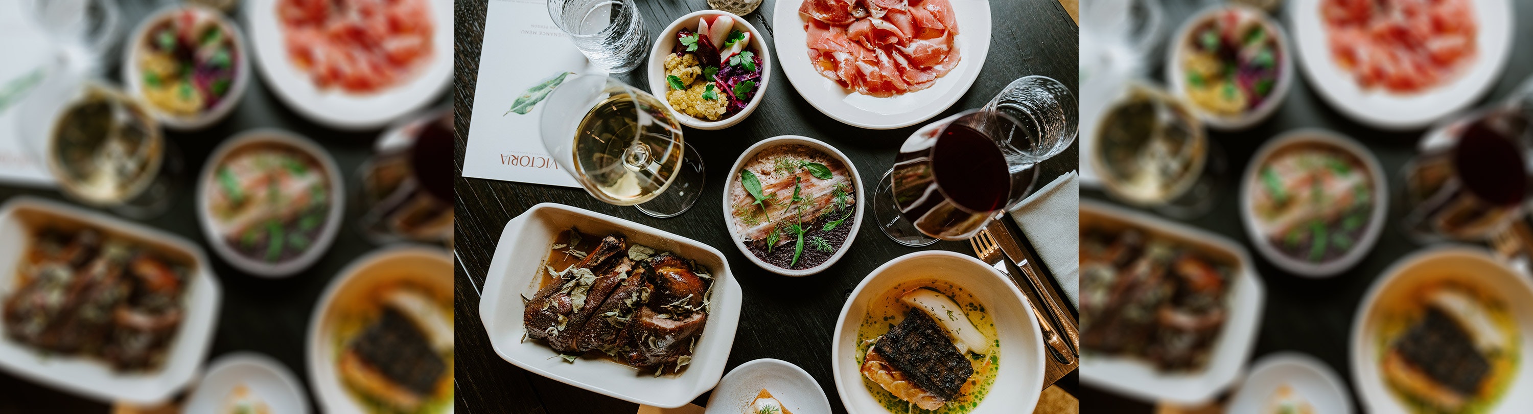 A selection of dishes and glasses of wine from above at Victoria by Farmer's Daughters