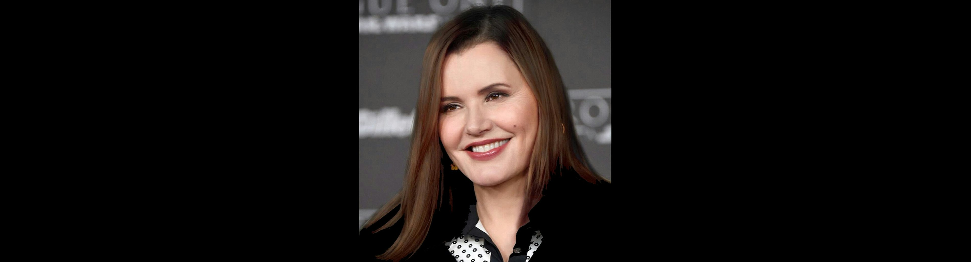 A head shot of Geena Davis on the red carpet at the opening of a film