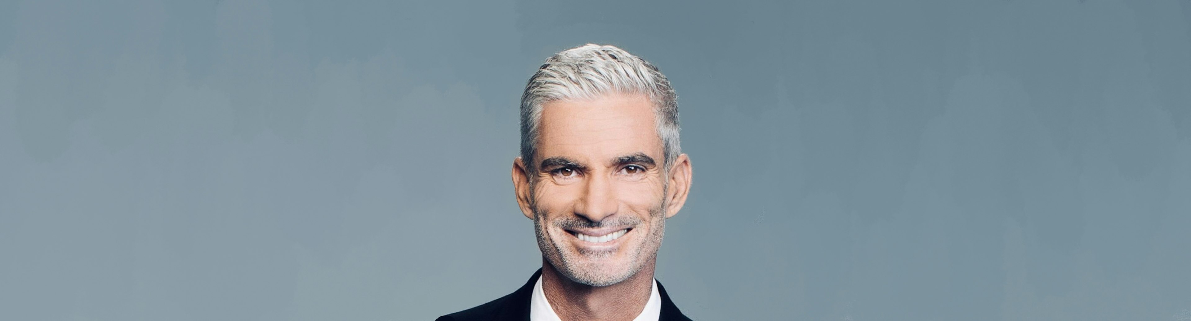 A head shot of Craig Foster smiling at the camera