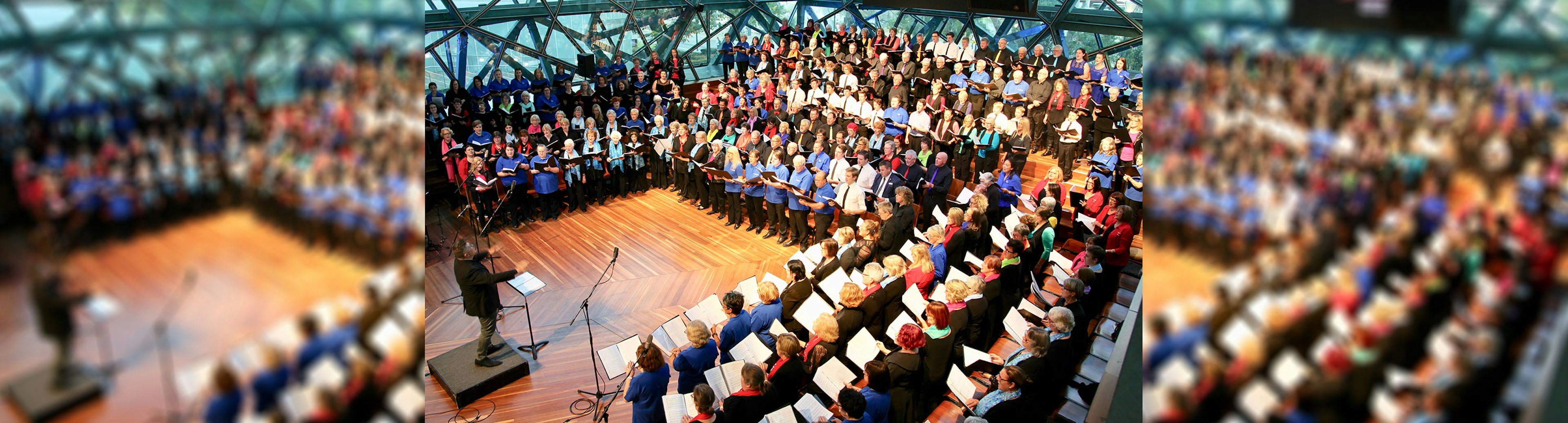 A large is setup in a U shape in The Edge at Fed Square with a conductor standing on the left side of the picture