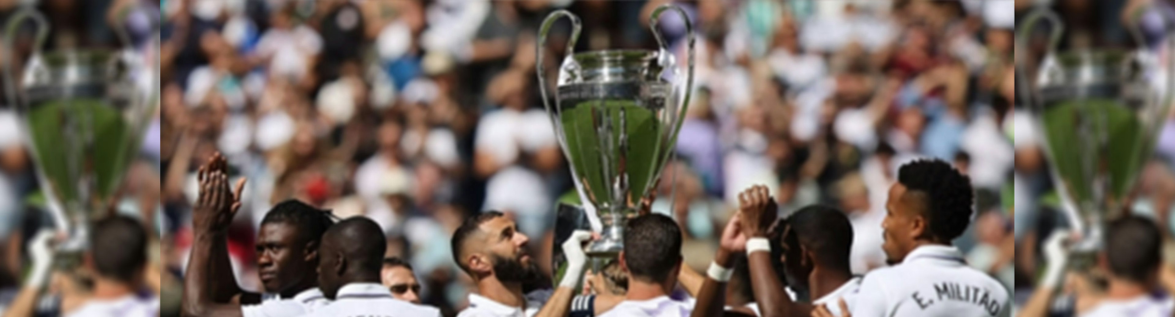 Real Madrid holding up the UEFA Champions League trophy