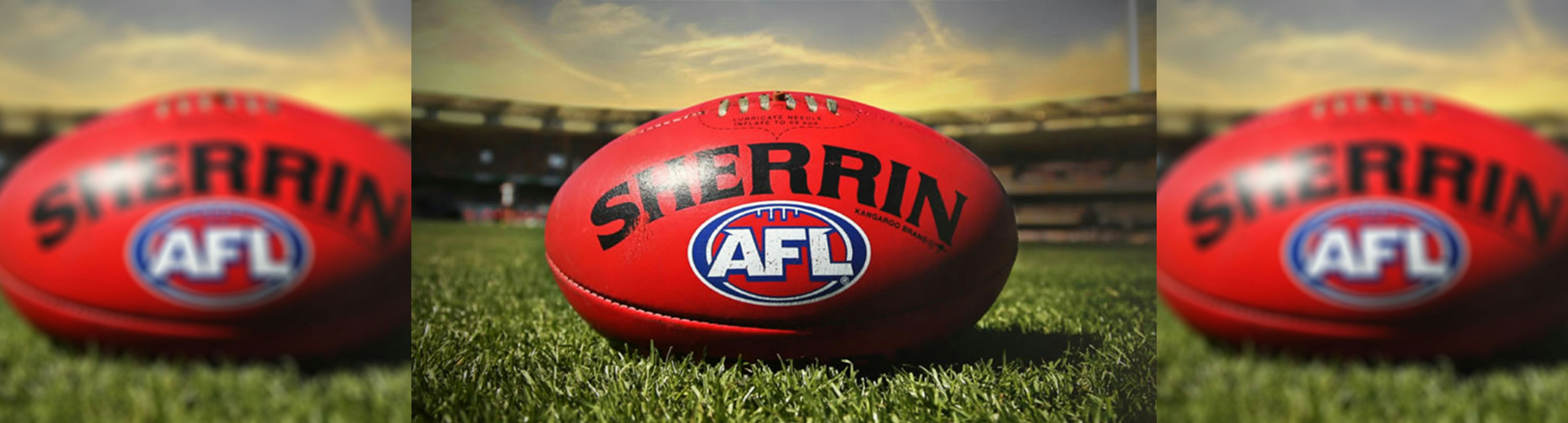 A red AFL Sherrin football with the AFL logo on it