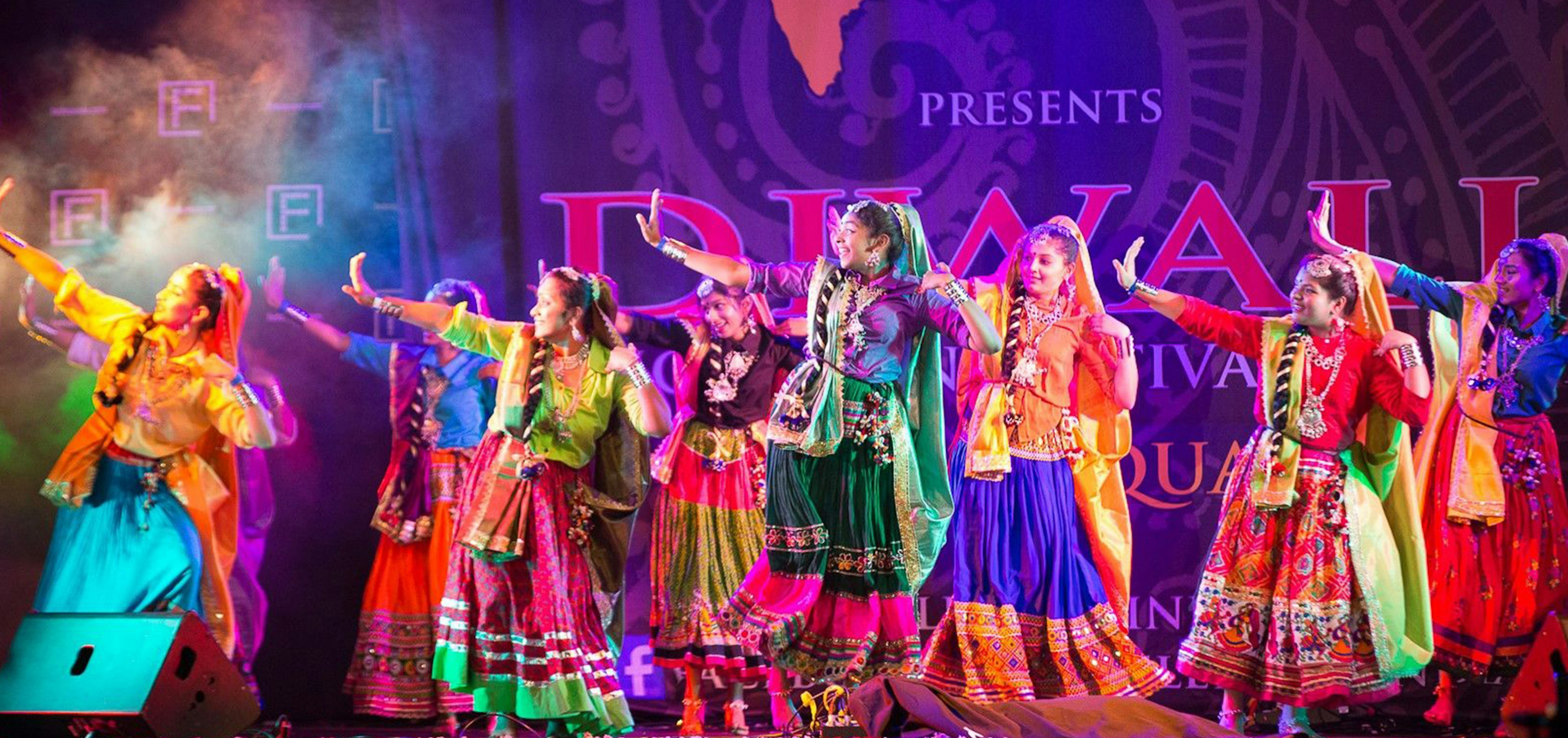 Indian dancers in the stage wearing colourful clothing at Fed Square