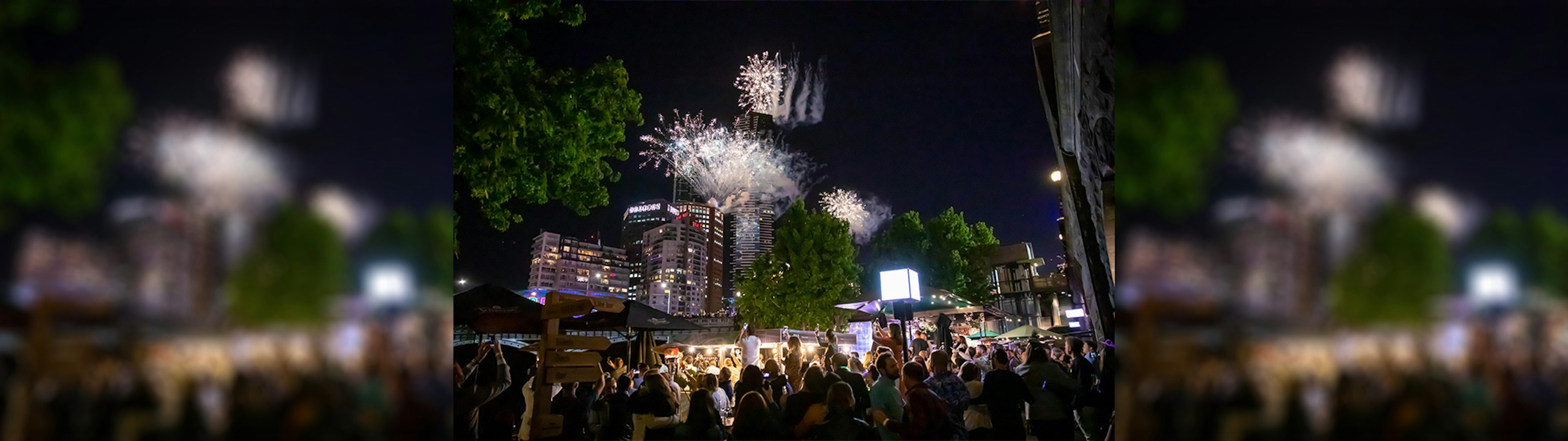 Riverland Bar along the Yarra River of an evening with fireworks overhead