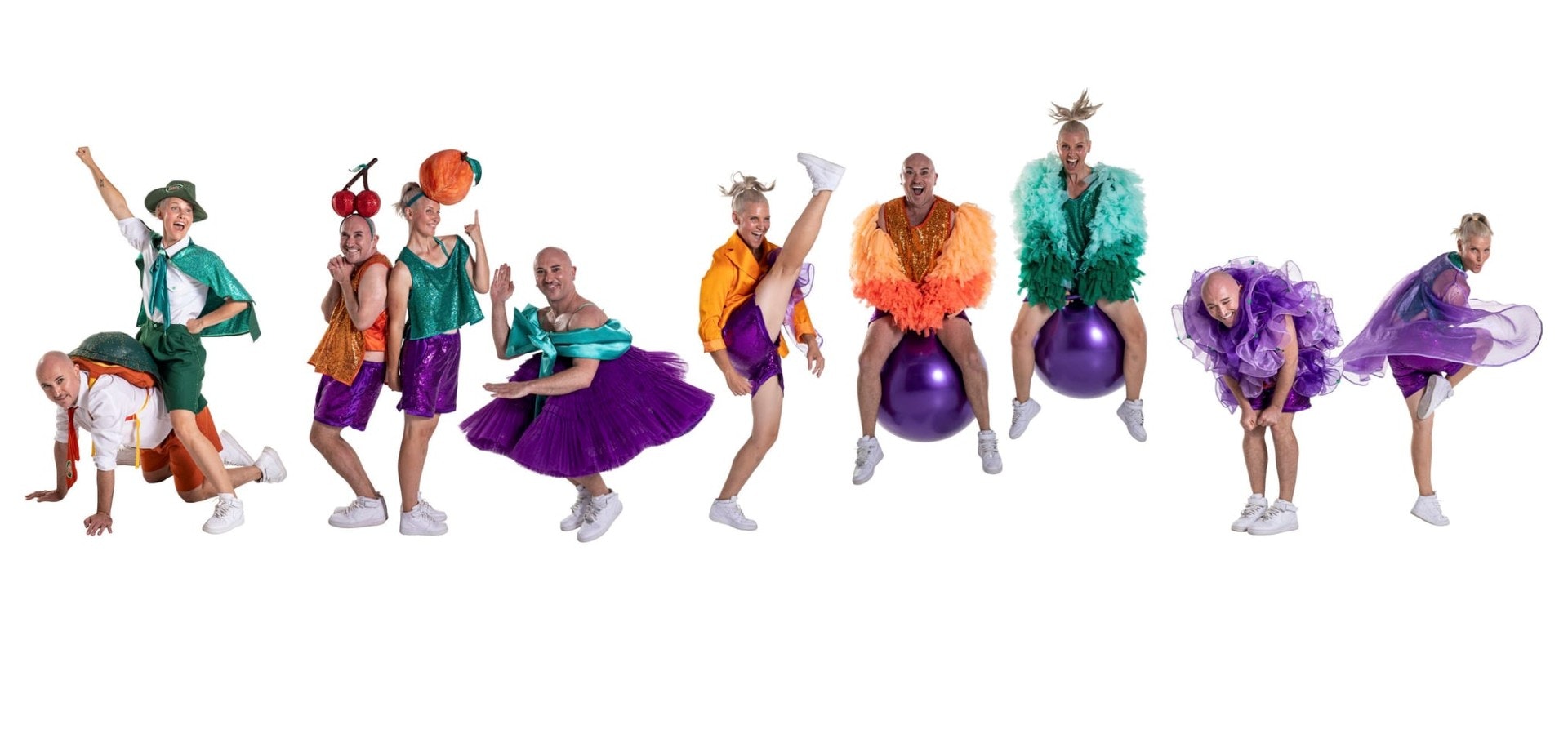 A row of repeated images of two people, dressed brightly in orange and teal, dancing and bouncing on a purple fit ball. A colourful fun line-up of characters