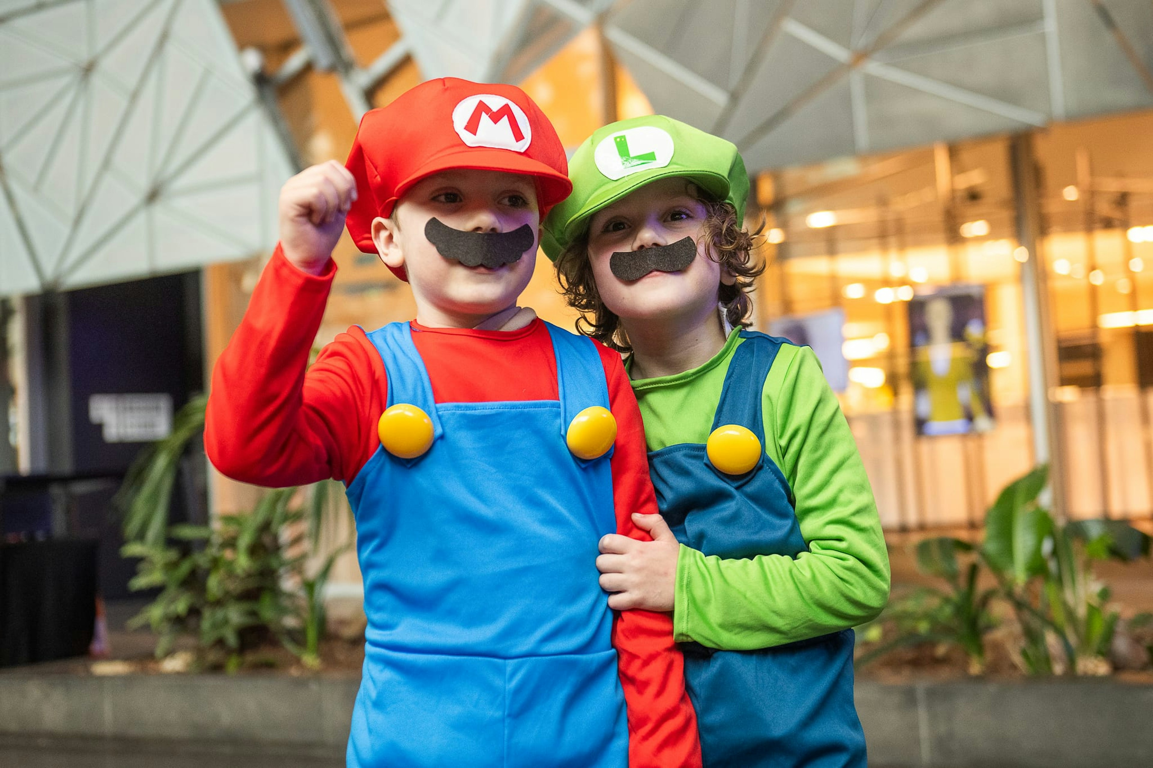 Two children dressed as Mario and Luigi