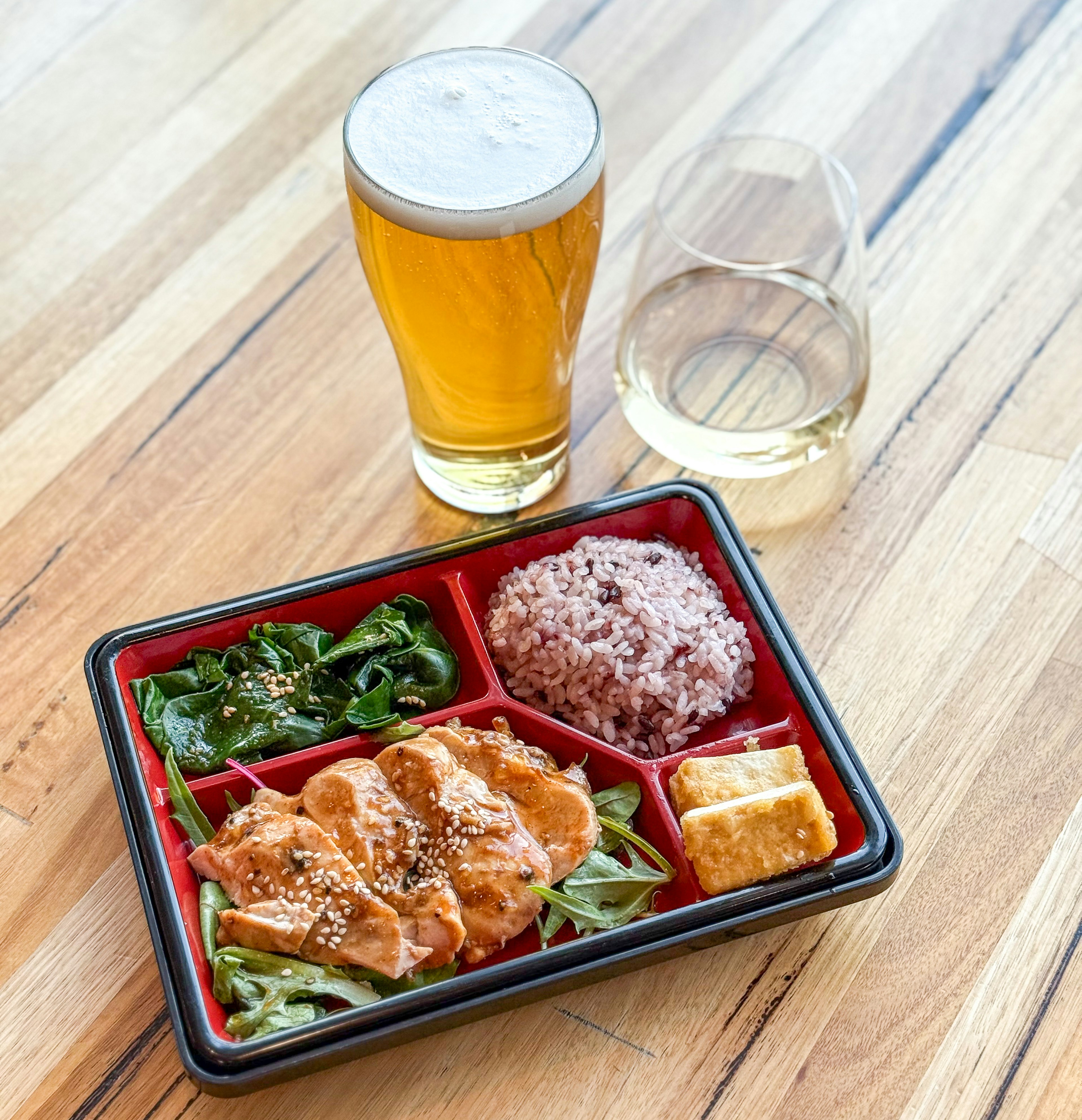 bento box with a beer or wine